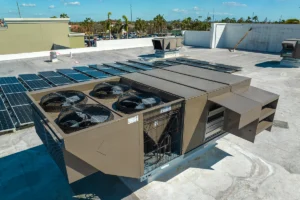 AC condenser fan motor shaft wobble from worn bearings vibrating housing in Alexis, NC: large commercial rooftop HVAC unit