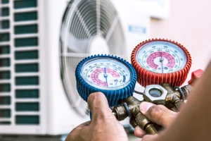 AC system pressure switch tripping cutting off compressor in Mount Holly, NC: close-up of manifold gauges being used